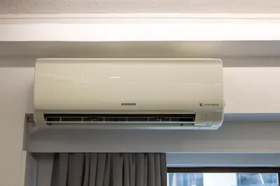 a air conditioner hanging from a ceiling in a room at Central BGC Forbeswood Heights in Manila