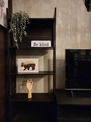 a shelf with a picture of a bear on it at Air Residences with 500Mbps Wifi in Manila