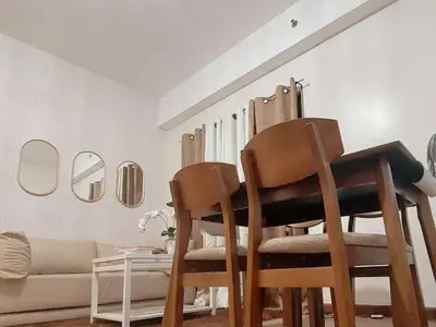 a living room with two chairs and a couch at Casa Josefina in Manila