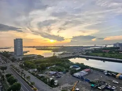an aerial view of a city with a sunset at Sabrina Staycaytion in Manila