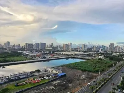 a view of a city with a river and buildings at Sabrina Staycaytion in Manila