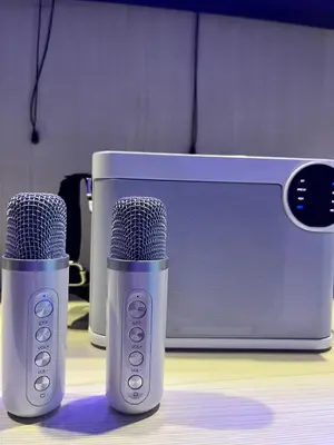 two microphones sitting next to a microwave at EaseStay by Bren in Shell Residences MOA in Manila