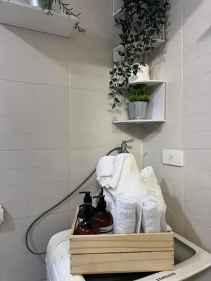 a bathroom with a sink with towels on it at Exquisite 2 Bedroom Suite in Manila