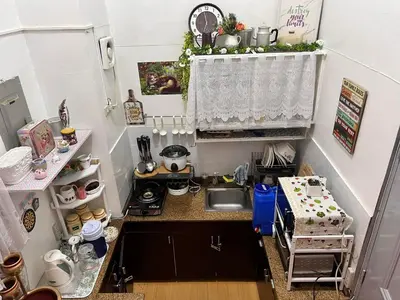 a small kitchen with a sink and a counter at Pahingahan in Cainta