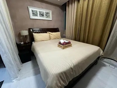 a bedroom with a bed with a box on it at Azure Urban Resort by Tallia & Tiffany in Manila