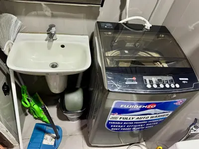 a small bathroom with a sink next to a sink at City Bliss Chill Vibes Makati 5338 Netflix Swim Gym Park Superfast Net in Manila