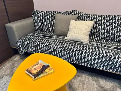 a living room with a couch and a yellow table at City Bliss Chill Vibes Makati 5338 Netflix Swim Gym Park Superfast Net in Manila
