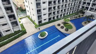an overhead view of a swimming pool in a building at Iyashi Pod in Manila