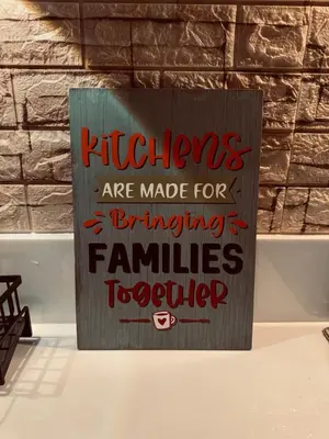 a sign that says kitchens are made for entertaining families toker at Air Residences Luxury Condo with Balcony Netflix Wifi in Manila