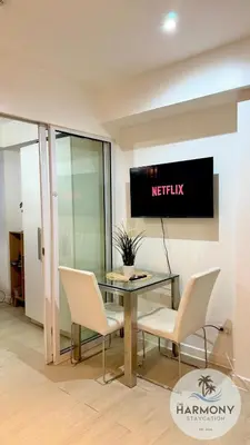 a meeting room with a table and two chairs at Azure Residences Staycation - Bahamas tower in Manila