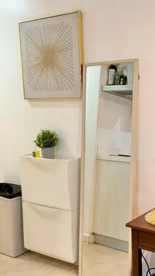 a white refrigerator in a kitchen with a mirror at Azure Residences Staycation - Bahamas tower in Manila