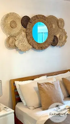 a bedroom with a bed with two mirrors on the wall at Azure Residences Staycation - Bahamas tower in Manila