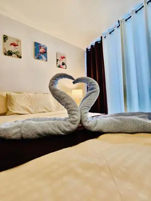 two snakes making a heart in a bedroom at Azure staycation by Marco in Manila