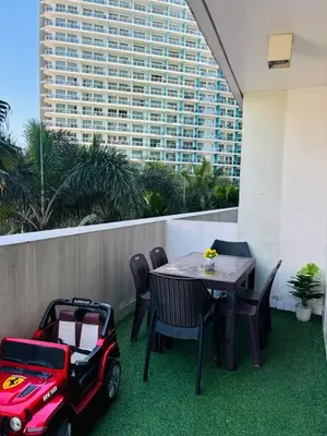 a patio with a table and a mobility scooter at Azure staycation by Marco in Manila