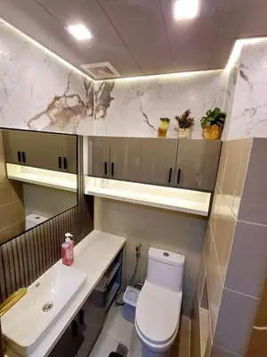 a bathroom with a white toilet and a sink at My Staycation moa area S RESIDENCES TOWER 1 in Manila
