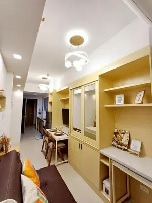 a living room with a couch and a table at My Staycation moa area S RESIDENCES TOWER 1 in Manila
