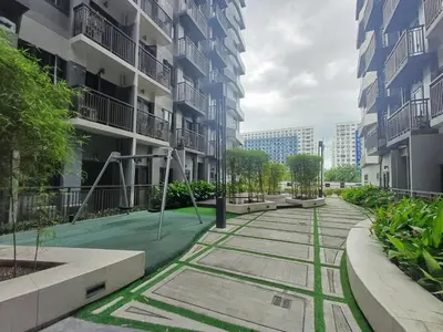 an empty street in a city with buildings at My Staycation moa area S RESIDENCES TOWER 1 in Manila