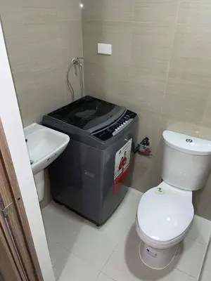 a small bathroom with a toilet and a sink at Shore 2 Residence Tower 3 in Manila