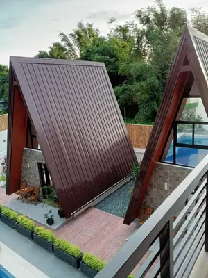an image of a house with a metal roof at tierra de segundo in Binangonan