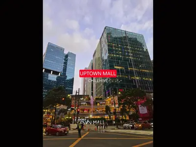 a view of a city with a downtown mall sign at 1BR Condo, BGC Uptown Mall, Grand Hyatt #ournw20j in Manila