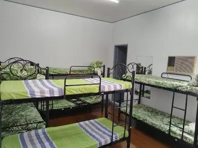 a group of bunk beds in a room at BahayMandaragat in Manila
