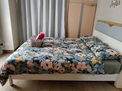 a bed with a blanket and a basket on it at LDN Secret 1BR across NAIA Terminal 3 in Manila