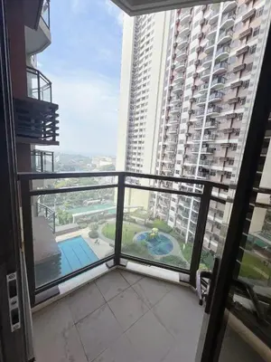 a view from the balcony of a condo in a building at Modern condo near US Embassy in Manila