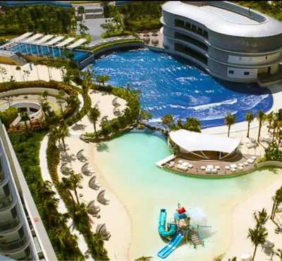 a pool at a resort with a water slide at Azure Resort Residence, 1bedroom with balcony Beach view in Manila