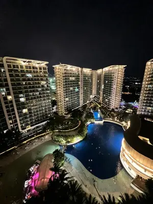a view of a city skyline at night at Azure Resort Residence, 1bedroom with balcony Beach view in Manila