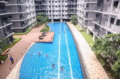 an overhead view of a swimming pool in a building at Comfort Cove at Shore 3 in Manila