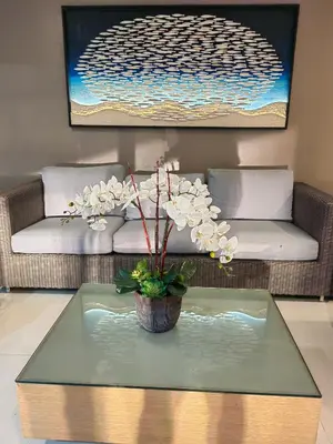 a living room with a coffee table and a couch at Sea residences by mavis in Manila