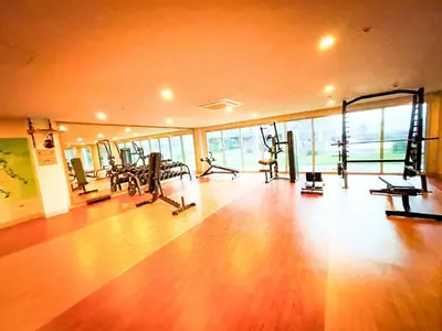 a gym with treadmills and machines in a room at Cozy 3BR near Airport & Okada, Solaire II Infinity Pool in Manila