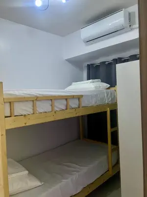 a bunk bed room with two bunk beds at 1 Br Family Suite in S Residences by JMS in Manila