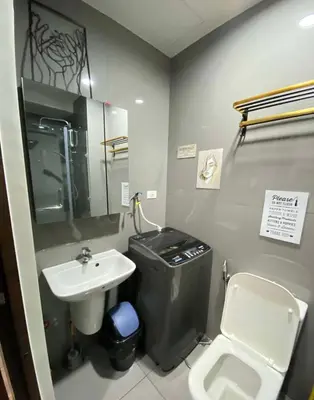 a bathroom with a sink and a toilet at Stylish Condo in Makati City with stunning views in Manila