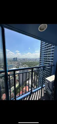 a view of a city from a balcony of a building at Stylish Condo in Makati City with stunning views in Manila