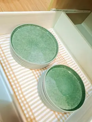 two plates sitting on a table in a drawer at Azure Condotel and Resort in the City in Manila
