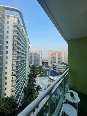 a balcony with a view of a resort at Azure Condotel and Resort in the City in Manila