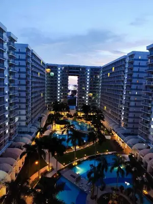 an aerial view of a large building with two pools at 1528 pool view with balcony in Manila