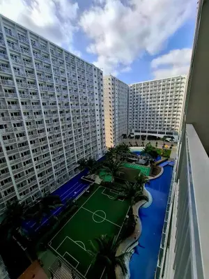 an aerial view of a large building with a tennis court at Wooden style amenities view in Manila
