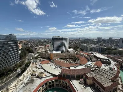 an aerial view of a city with buildings at Deluxe Suite in Venice Mall in Manila