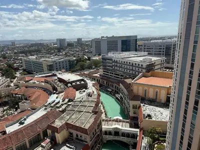 an aerial view of a city with a river and buildings at Deluxe Suite in Venice Mall in Manila