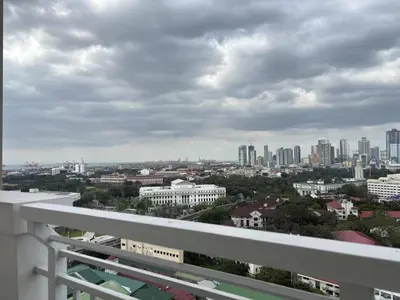 a view of a city from the balcony of a building at Bless View at 16th in Manila