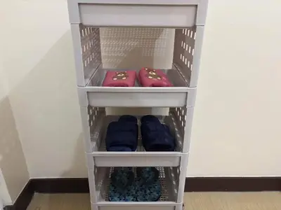 a shelf with three pillows in a room at Bless View at 16th in Manila