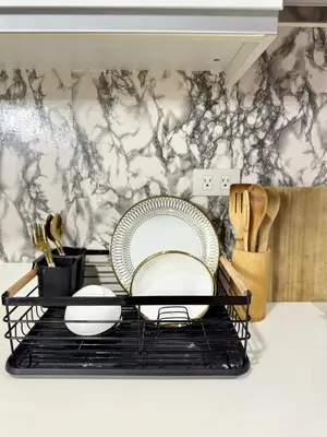 a plate on a rack in a kitchen at Cozy Condo near Manila Airport in Manila
