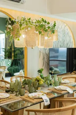 a table with plates and plants on top of it at Tropical Sunset w the best view in BGC plus Netlfix in Manila