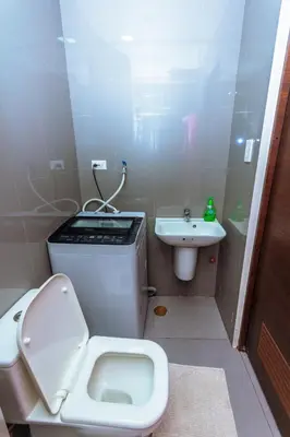 a small bathroom with a toilet and a sink at City of Dreams Luxury Makati 5637 Swim Gym Netflix Superfast Surfing in Manila