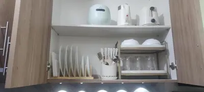 a cupboard with utensils and utensils at Casa y' Bonita MOA Pasay Staycation in Manila