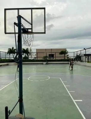 a basketball hoop on a tennis court at The Carly Suite in Manila