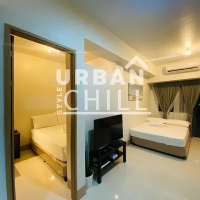 a hotel room with a bed and a mirror at Urban Style Chill with Free Parking, Shore 3, MOA Complex Pasay, Manila in Manila