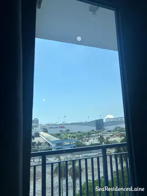 a view of a city from a balcony at Sea Residences by Laine in Manila